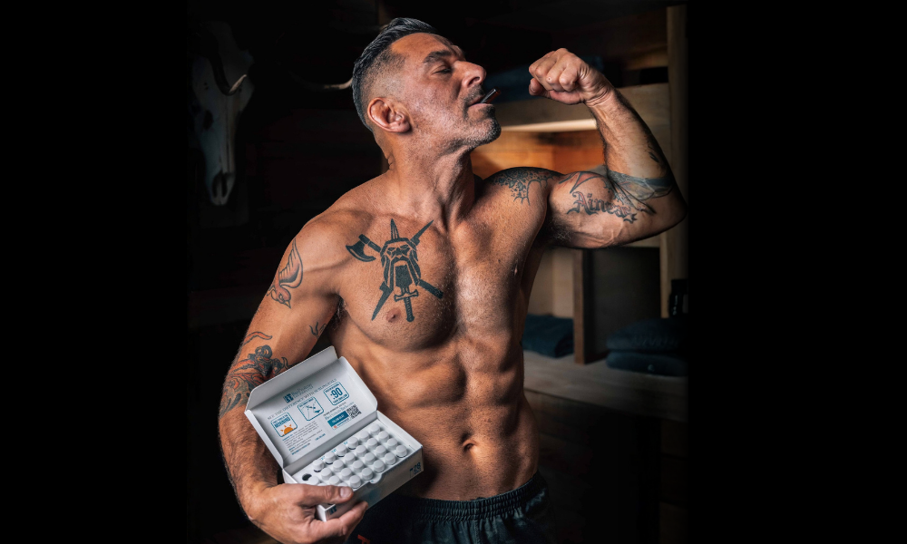 Lean, athletic man in his late 30s training in the gym